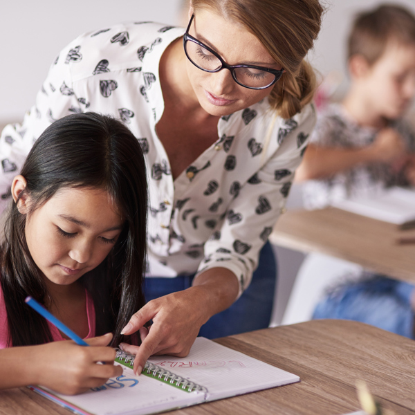 Teacher Helping Girl Homework