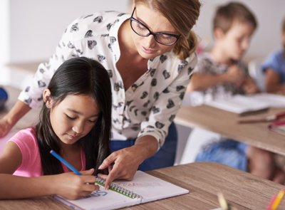 Teacher Helping Girl Homework