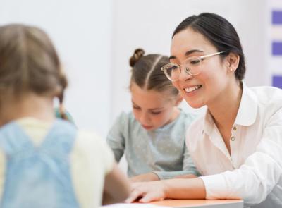 Woman Talking With Her Students During Class